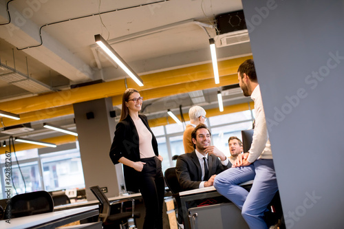 Senior businesswoman and young business people work in a modern office