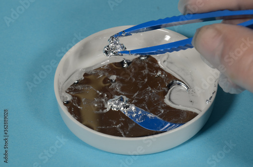 The element Gallium in molten form, crystals of Gallium can be picked from the bottom of the melt.