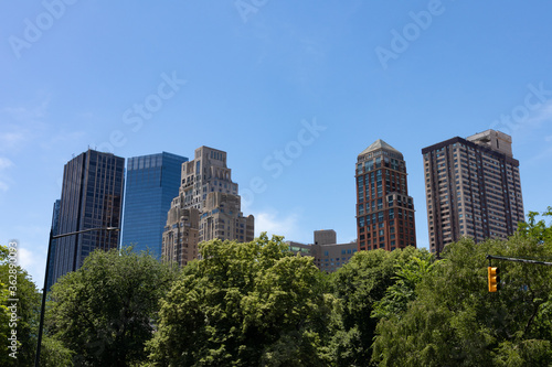 Lincoln Square New York Skyline seen from Central Park with Green Trees © James