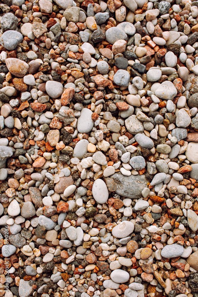 The texture of the little pebbles on the beach. Shoot from above space for message