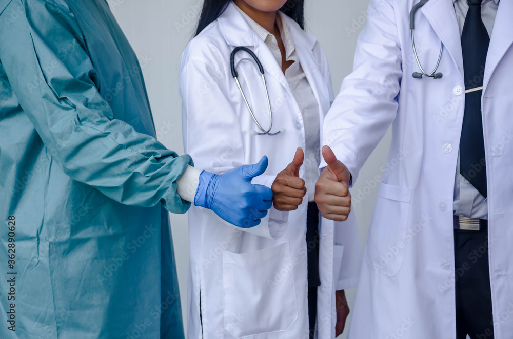 Close-up of doctor teamworking,Anesthesiologist,General Surgeon, General internists clasping hands,teamwork clasping hands. Close-up of doctor teamworking,Anesthesiologist,General Surgeon, General internists clasping hands,teamwork clasping hands.