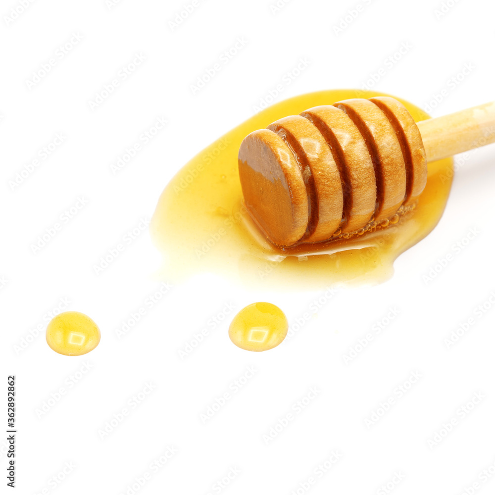Drops of honey and dipper on white background. Drops of honey and dipper on white background.