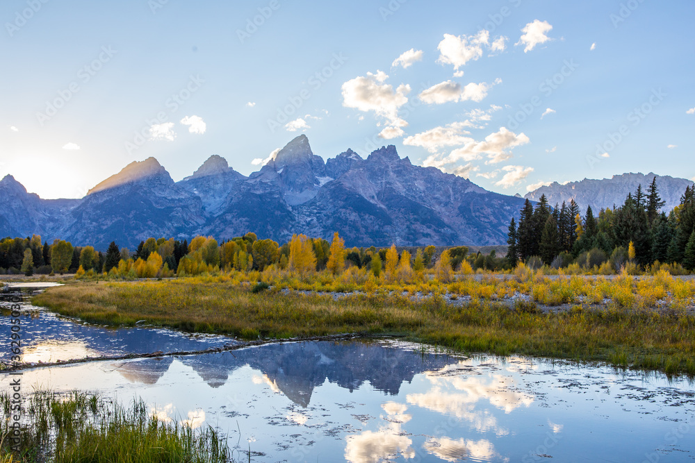 The mountain Grand Teton and a reflection at sunset, shot at autumn time.