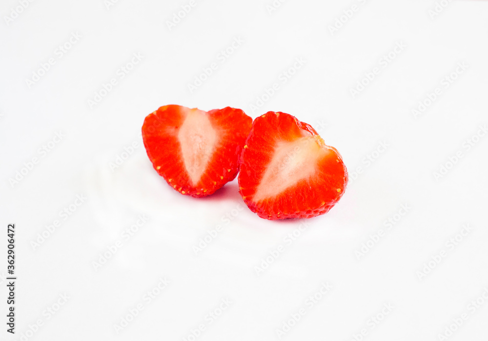 Cut into two halves strawberries isolated on a white background Cut into two halves strawberries isolated on a white background
