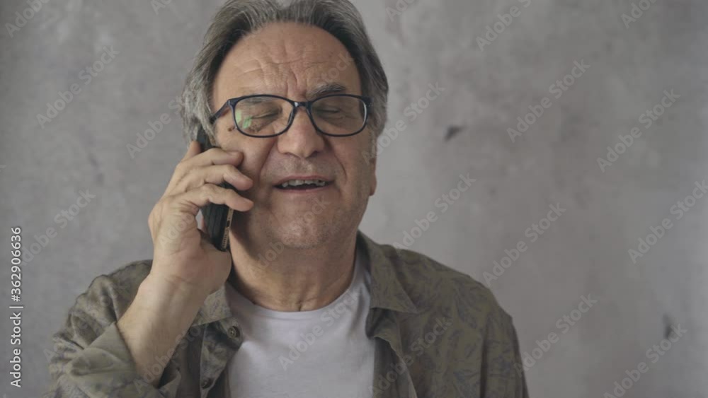 Senior man talking to mobile phone Senior man talking to mobile phone
