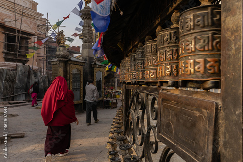 Fototapeta Naklejka Na Ścianę i Meble -  Monk walking in a Kathmandu Temple