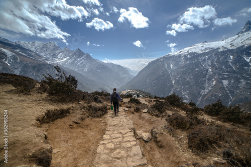 Female hiker with Himalayan mountains as background