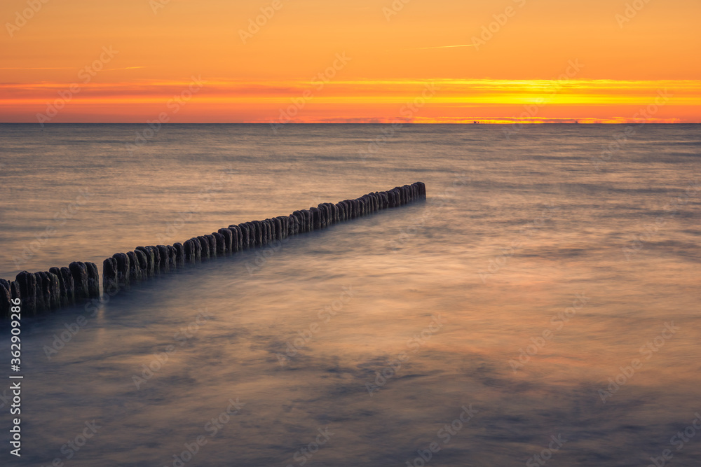 Naklejka premium Sunset on the Baltic Sea in Miedzyzdroje, Zachodniopomorskie, Poland