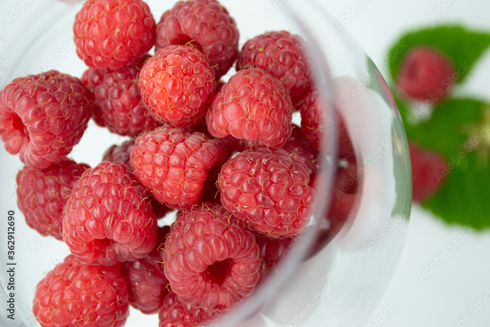 Raspberries lie in a glass Raspberries lie in a glass