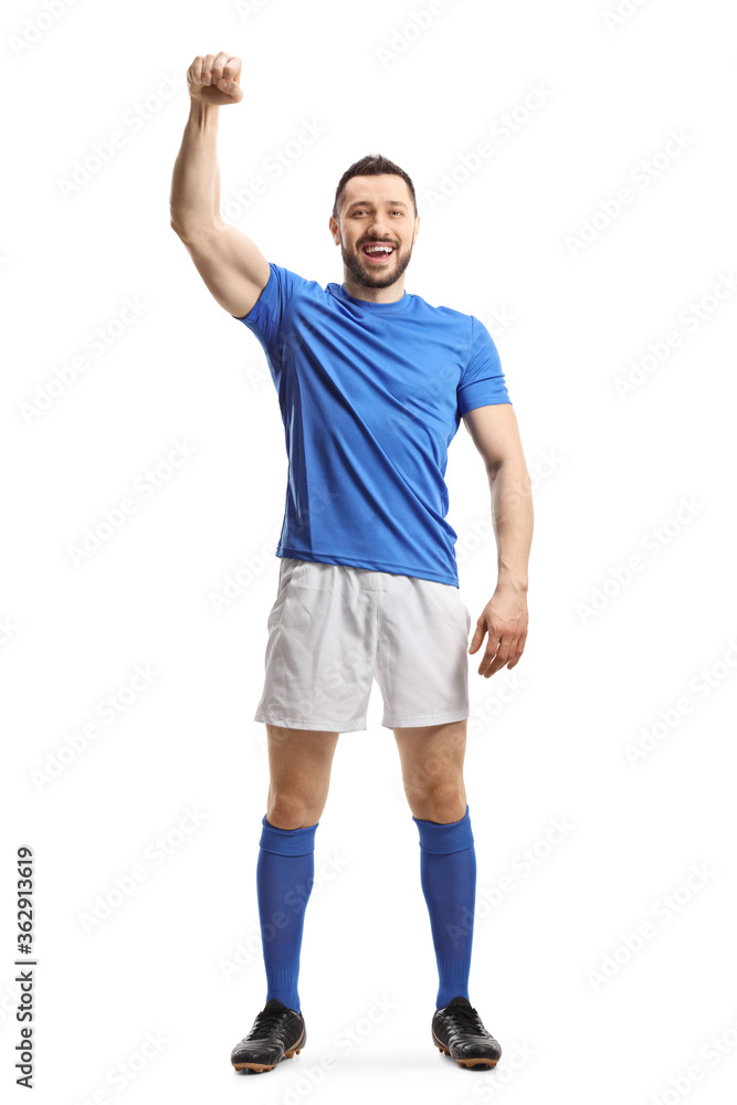 Soccer player in a blue top and white shorts raising a hand Soccer player in a blue top and white shorts raising a hand