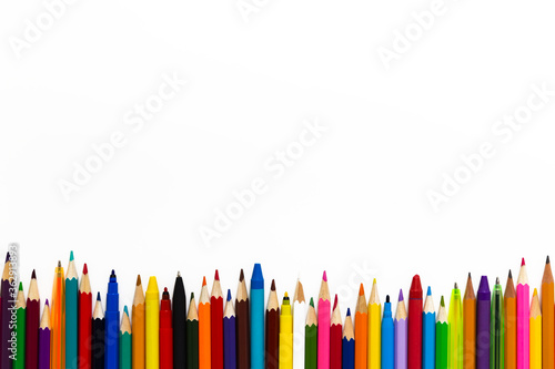 Color pencils, pens and wax crayons border isolated on white background. Mockup