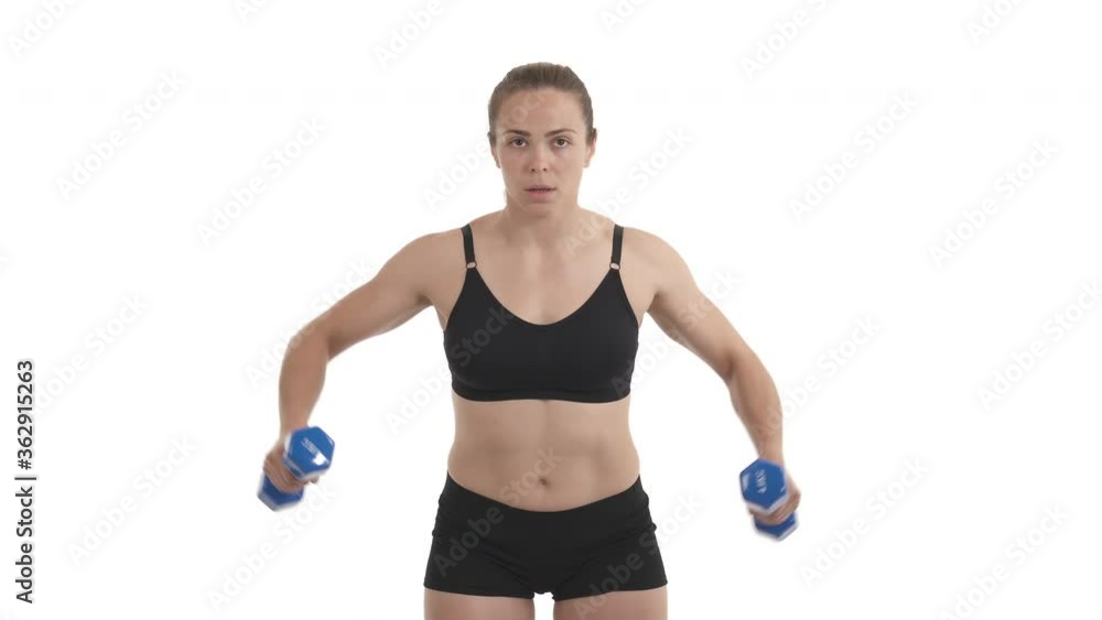 front view portrait of blond sportswoman training deltoid muscle with dumbbells. Isolated on white background. front view portrait of blond sportswoman training deltoid muscle with dumbbells. Isolated on white background.