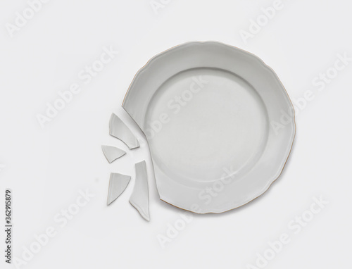 Top view of broken plate isolated on white.Studio