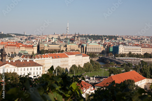  Panoramic view of the roofs in Prague from red tiles on a sunny day general plan.