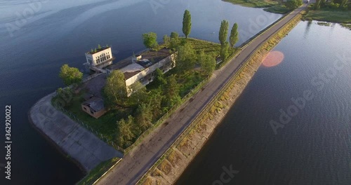 Aerial view to old pumping station on dam photo