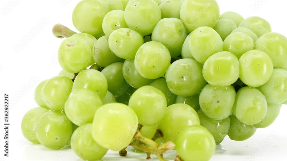fresh green grapes fruit on white background, video footage.