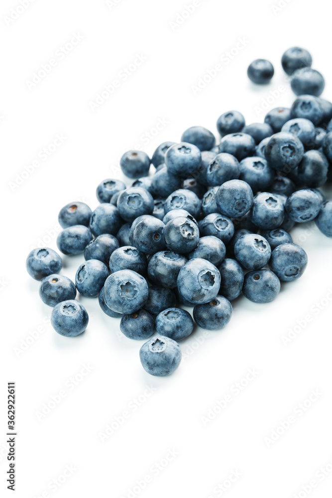 Blueberries are scattered on a white background. Free space, isolate. Studio light. Blueberries are scattered on a white background. Free space, isolate. Studio light.