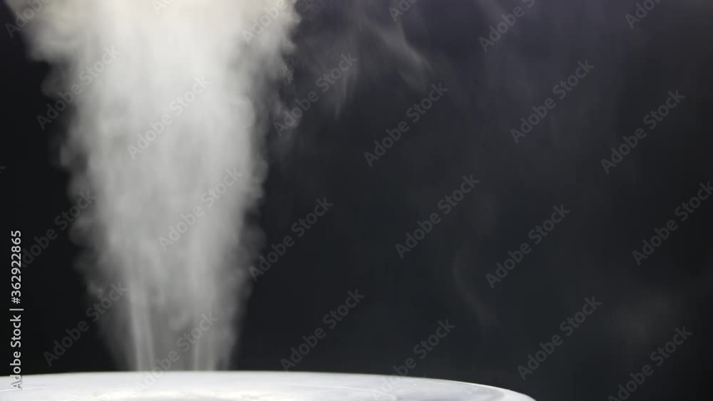 White steam of ultrasonic humidifier. Frume of vapor from diffuser for ...