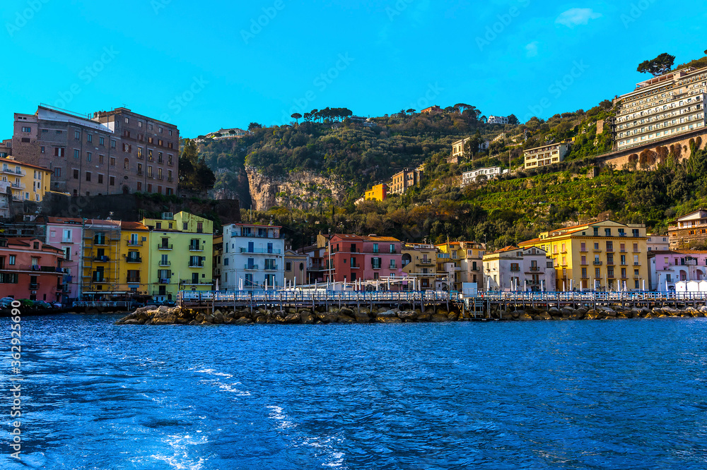 A view looking towards the shore past the harbour wall of the marina Piccola, Sorrento, Italy