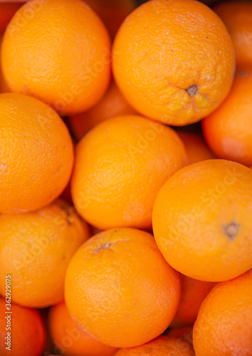 Orange fruits. Oranges for sale. Background oranges. Lots of fresh oranges fruits.