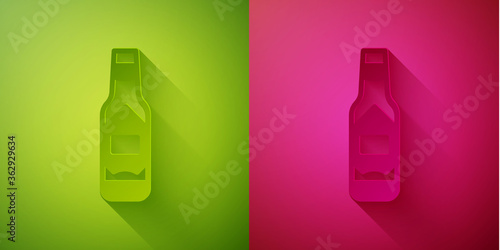 Paper cut Tabasco sauce icon isolated on green and pink background. Chili cayenne spicy pepper sauce. Paper art style. Vector.