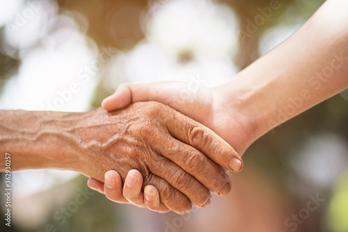 image of handshake old man with young man 