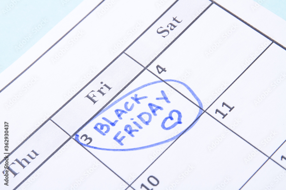 Black friday reminder in a calendar. Calendar day circled by a blue marker. Black friday reminder in a calendar. Calendar day circled by a blue marker.