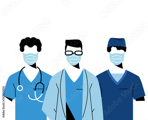 Young professional doctors wearing face masks