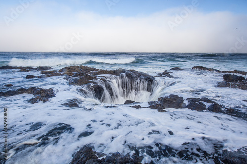 Thor s well  a big round shaped waterfall at the coast in Oregon.