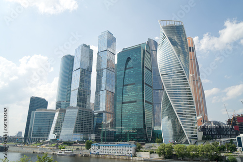 modern skyscrapers business center with blue sky and clouds, reflections on glass, Moscow city