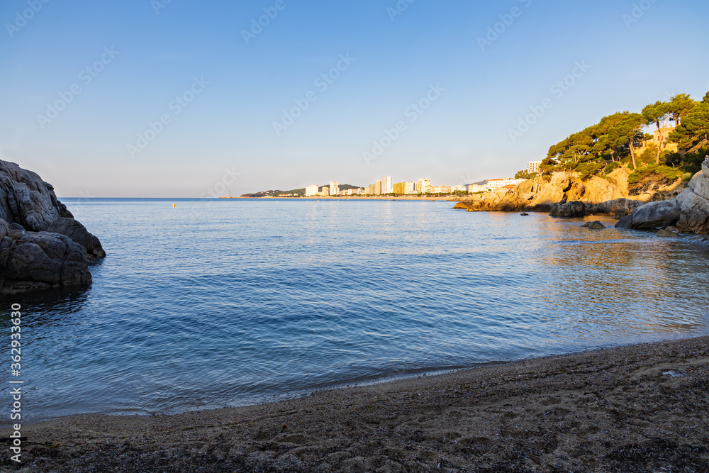 View of the St. Jordi cove with the first rays of the sun, Costa Brava, Catalonia, Spain.