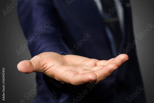 A businessman empty hand with black background