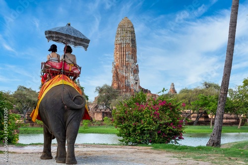 The Elephant for tourist service at Ayutthaya Archeology, Tourists riding elephant  in ancient history architecture in Ayutthaya Historical Park, Ayutthaya ,Thailand. © Kalyakan