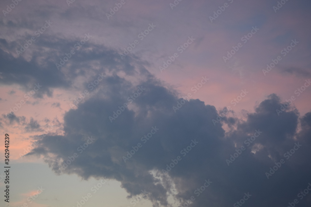 A pink, cloudy sunset sky