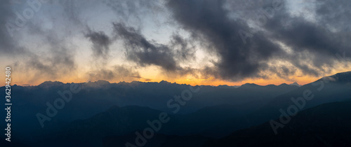 Silhouette Maritime Alps mountain range against sky at sunset, South France