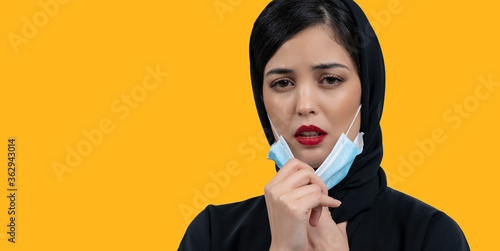 Bilde på lerret Arab Woman with protective face mask off and breathing fresh air