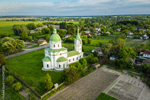 Greek Orthodox Church, religious, building XVIII century. Three Saints Church in Lemeshi, Chernigiv region, Ukraine aerial view. photo