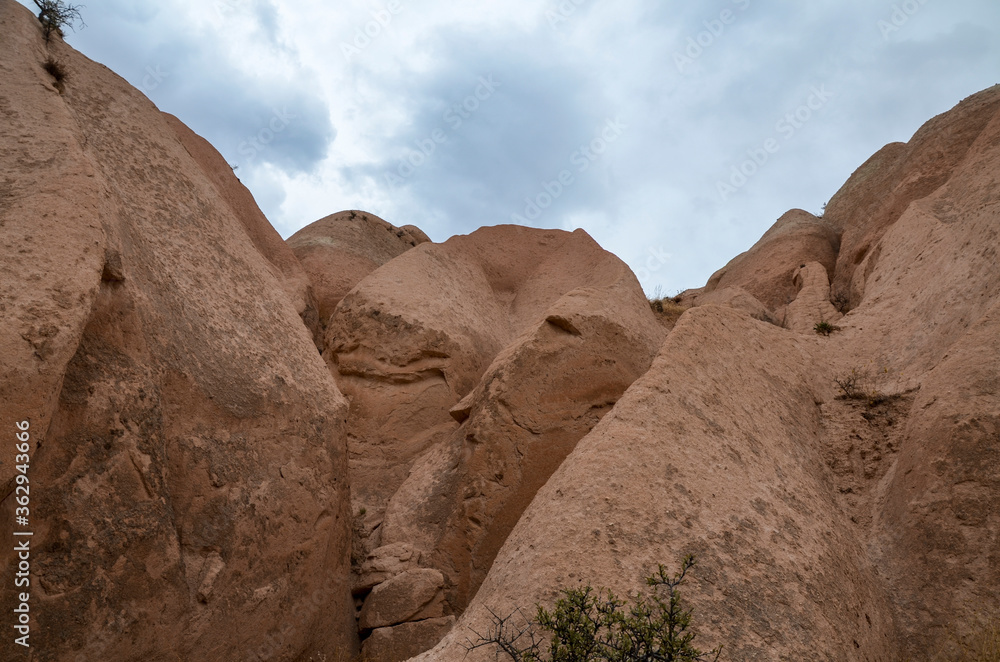 Fototapeta premium Unique limestone pyramids with beautiful old rock formations in Cappadocia, Goreme, Turkey
