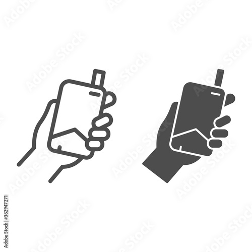 Hand with electronic cigarette line and solid icon, Smoking concept, E cigarette in hand sign on white background, Smoking device in hand icon in outline style for mobile and web. Vector graphics.