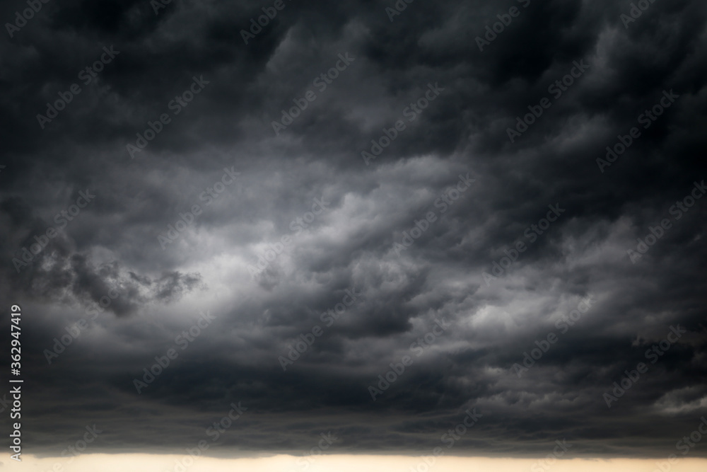 Sky covered with dark storm clouds. Dramatic background for weather before rain Sky covered with dark storm clouds. Dramatic background for weather before rain
