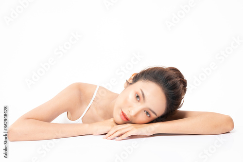 Beautiful Asian woman looking at camera smile with clean fresh skin