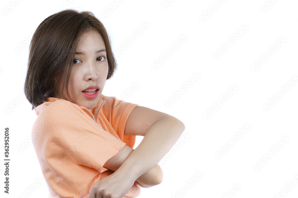 woman taking off her orange shirt, side view. White background. woman taking off her orange shirt, side view. White background.