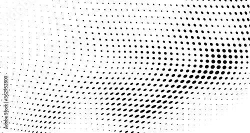 Chaotic abstract hafton background. Waves of black dots on white