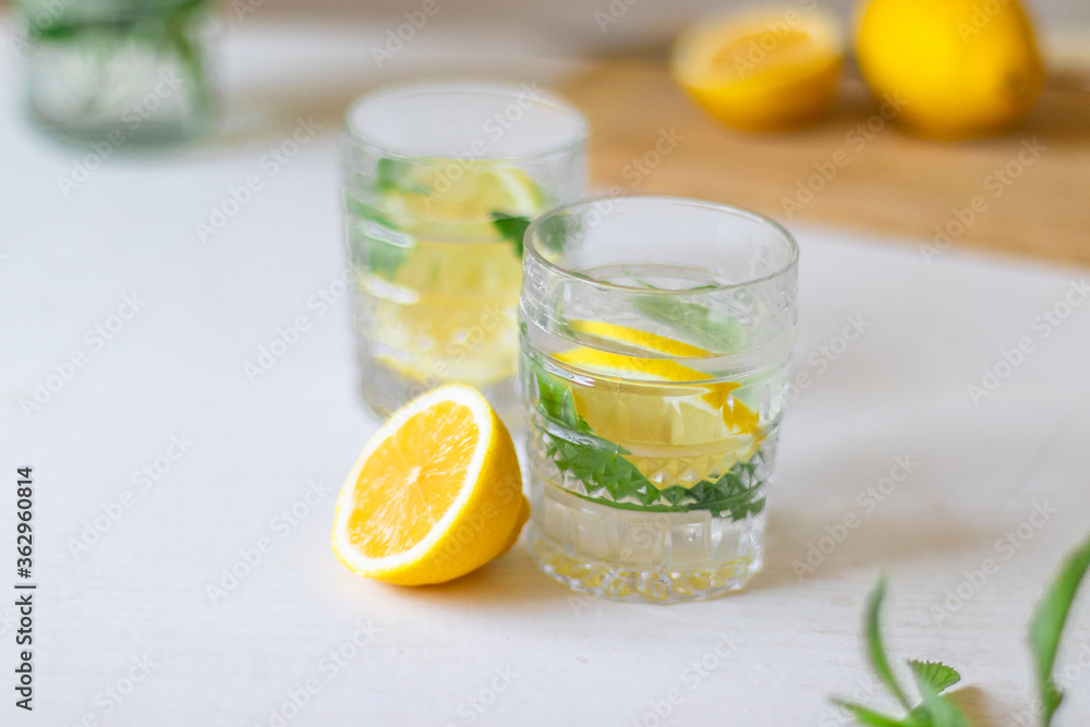 Top view of refreshing lemonade in glass on white background. Summer drinks with ice Top view of refreshing lemonade in glass on white background. Summer drinks with ice