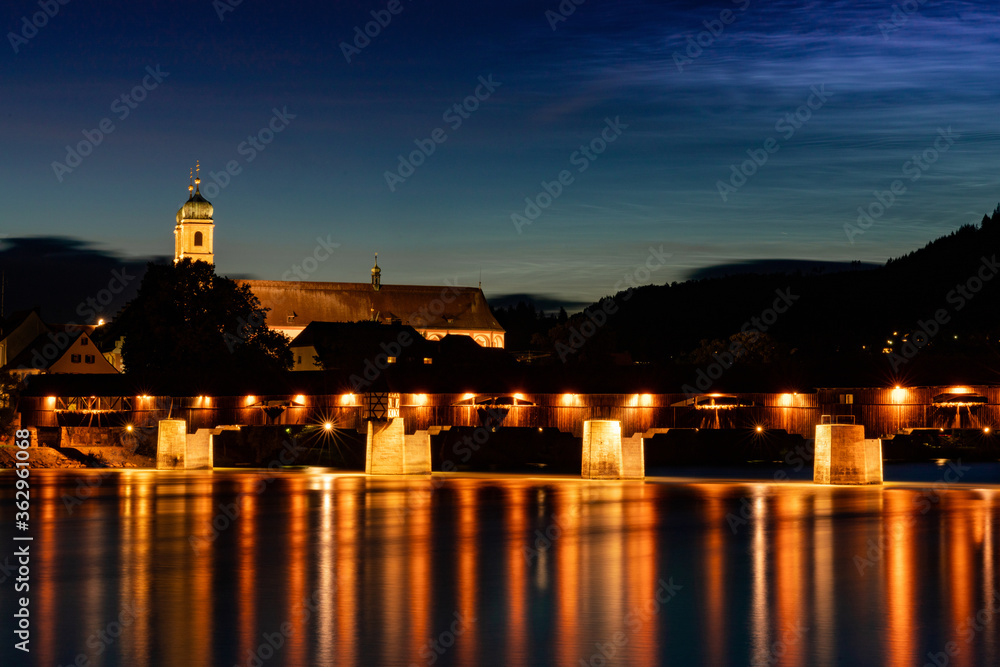 view of the St. Fridolin cathedral and Rhine bridge in Bad Saeckingen at night