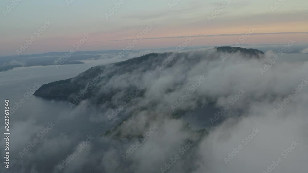 Aerial view above thich fog Mount Kineo looking over Moosehead lake Aerial view above thich fog Mount Kineo looking over Moosehead lake