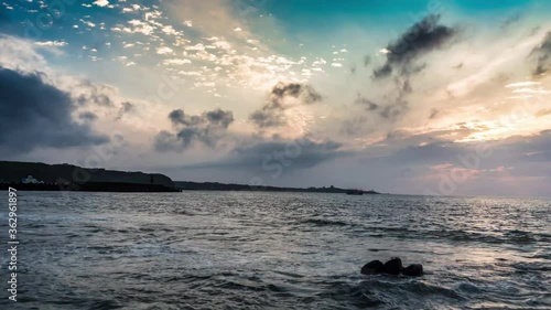 Time-lapse movie of sunset at the seaside of Shimendong, Taipei, Taiwan photo