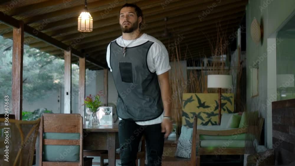 European guy sitting alone in an empty cafe turns his head and looks forward then gets up and leaves European guy sitting alone in an empty cafe turns his head and looks forward then gets up and leaves