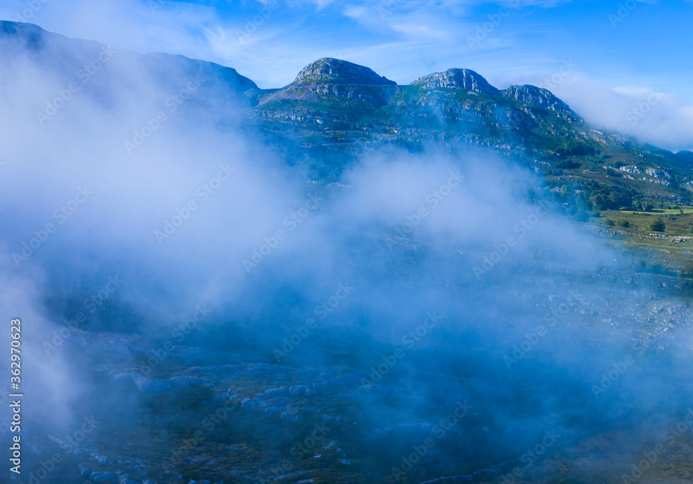 Mists in the Port of the Portillo de Lunada. Pasiegos Valleys. Merindades region. Burgos province. Community of Castilla y León. Spain, Europe Mists in the Port of the Portillo de Lunada. Pasiegos Valleys. Merindades region. Burgos province. Community of Castilla y León. Spain, Europe