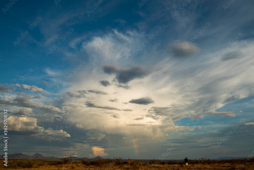 A rainbow appears in a monsoonal storm. A rainbow appears in a monsoonal storm.